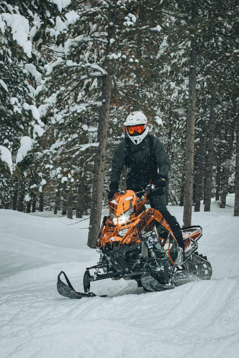 Snowmobile on a snowy forest trail